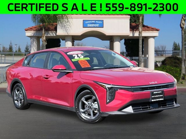 2025 Kia K4 LXS in Currant Red — front three-quarter view