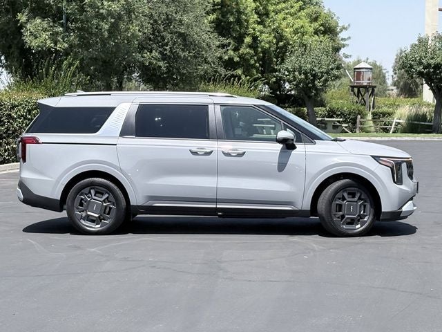 2026 Kia Carnival Hybrid — rear three-quarter view