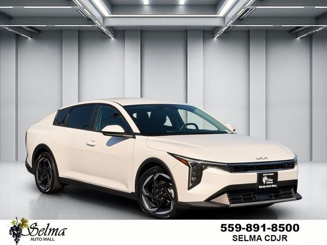 2025 Kia K4 EX in Snow White Pearl — front three-quarter view