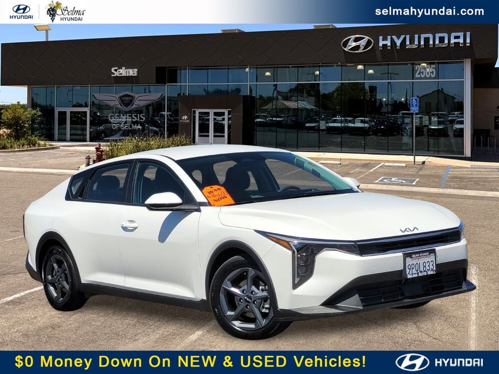 2025 Kia K4 LXS in Snow White Pearl — front three-quarter view